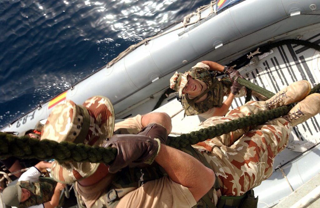 Members of the Boarding Team assigned to the Spanish frigate SNS Numancia (F 83) use a fast-rope ...