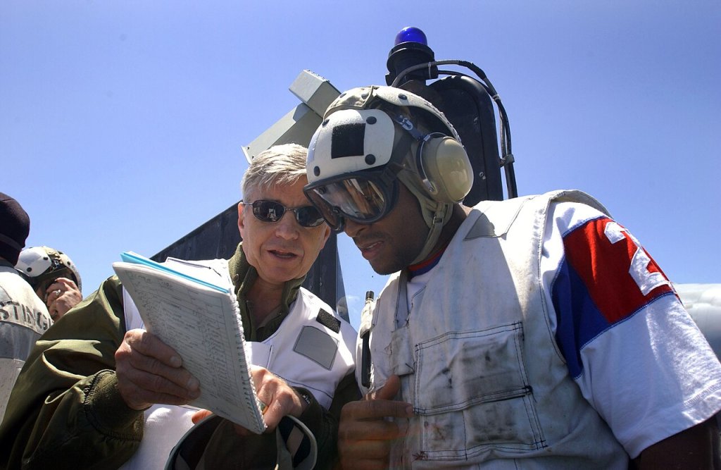 Morlon Greenwood, a linebacker for the Miami Dolphins, observes flight operations with Commander ...