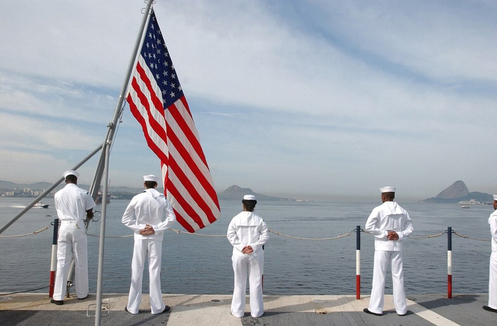 Aboard USS Ronald Reagan (CVN 76), June 9, 2004 - Sailors "Man the Rails" while a color detail ti...