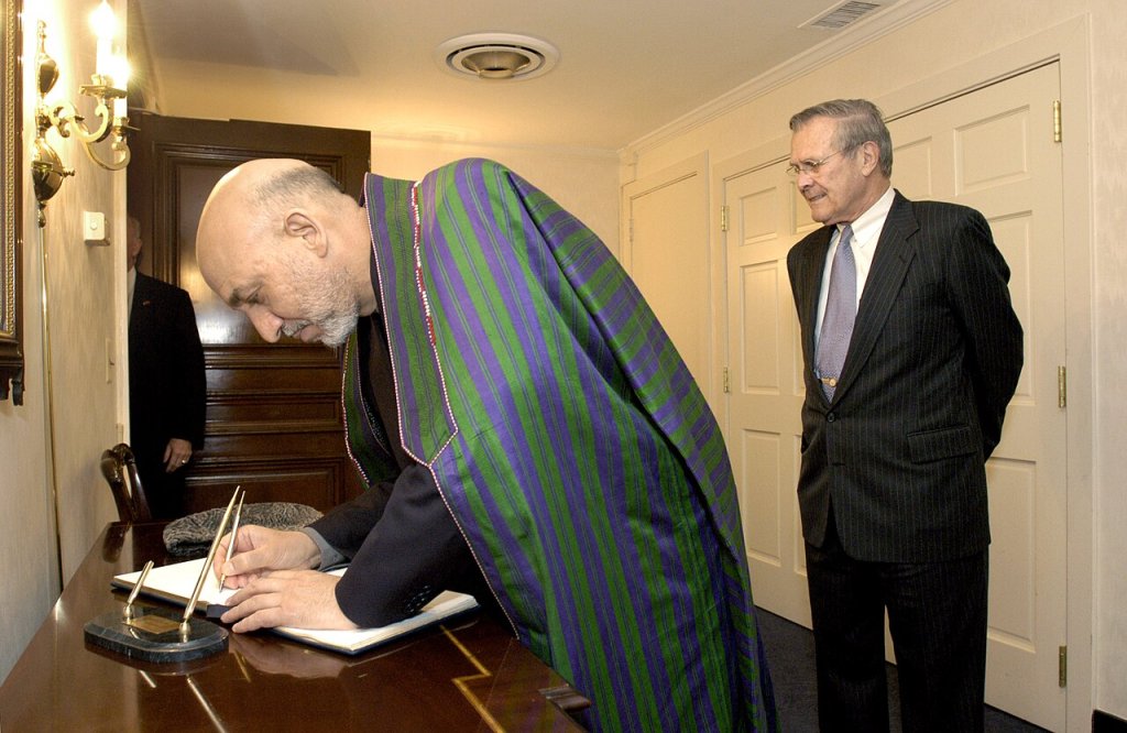 Afghan President Hamid Karzai signs the guest book at the Pentagon