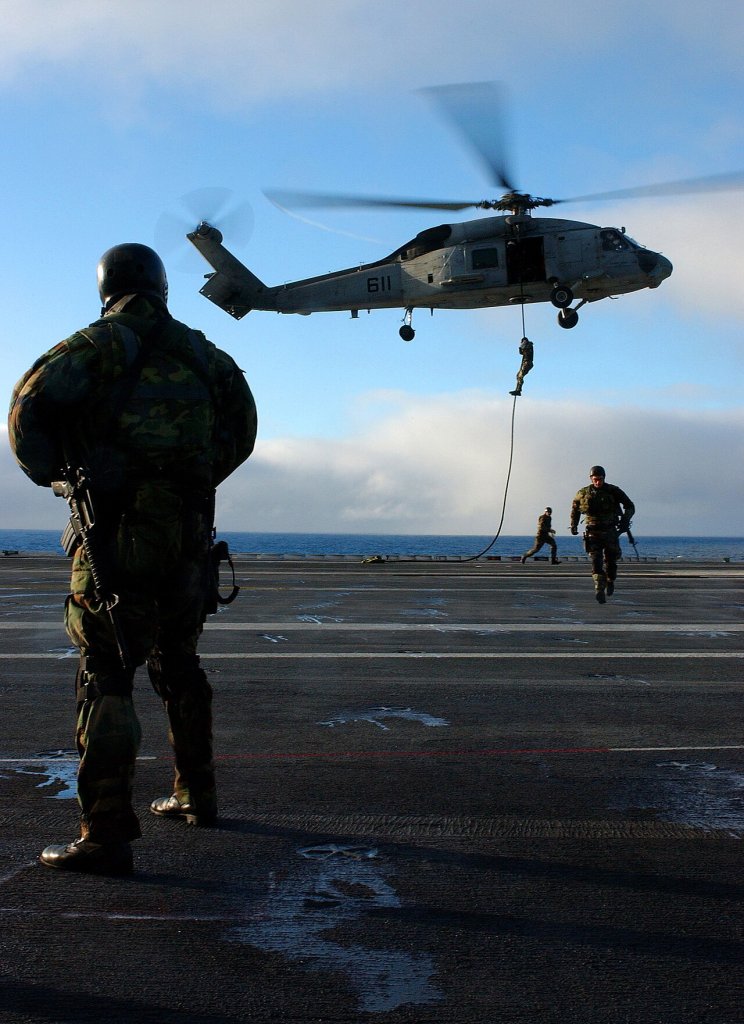 Pacific Ocean (June 19, 2004) - Members of Explosive Ordnance Disposal (EOD) Mobile Unit 11 emb...