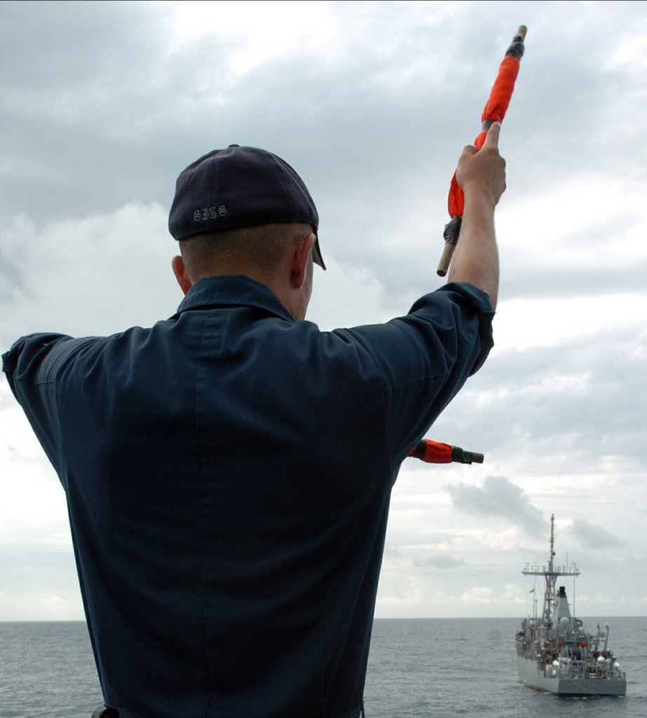 Quartermaster 1st Class Jesse Gaytan assigned to mine countermeasure ship USS Scout (MCM 8) commu...