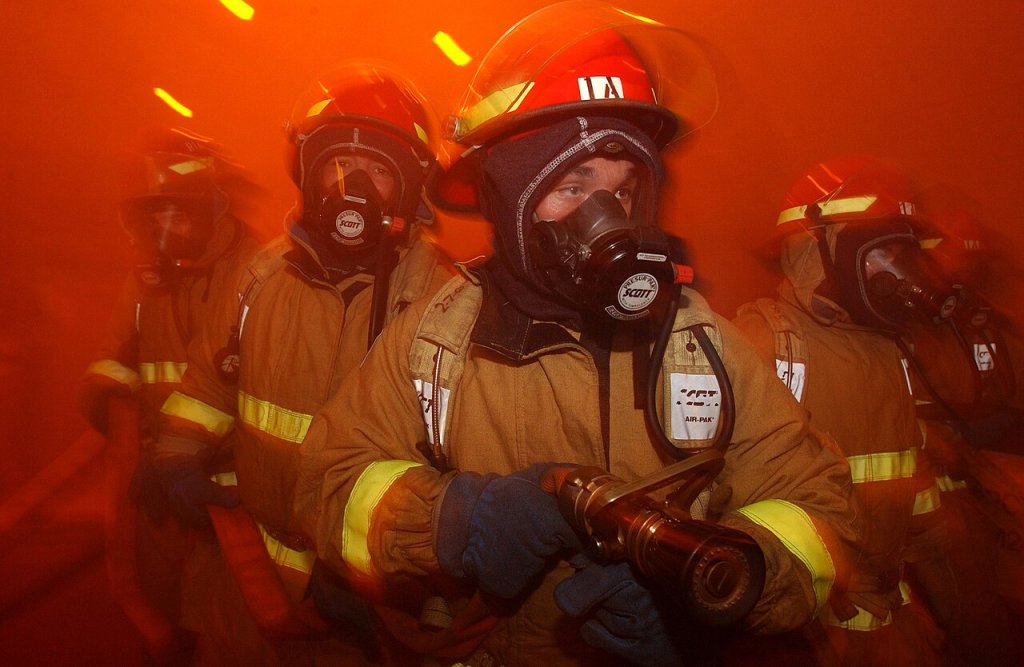 Sailors from repair locker "One Alpha" simulate fighting fires in the hangar bay, during a Ge...
