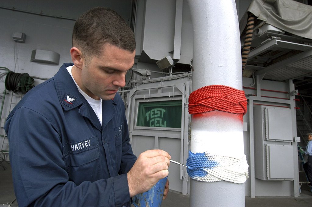 Boatswain's Mate 3rd Class Christopher Harvey, from Islamorada, Fla., puts the finishing touches ...