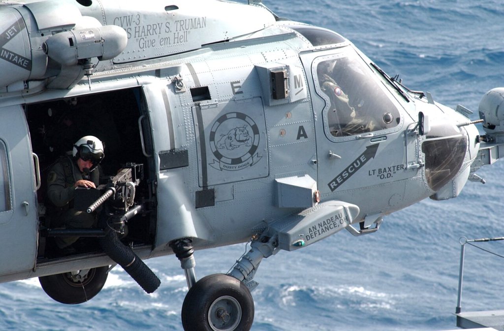 Aviation Warfare Systems Operator 2nd Class Bryan Branco stands a force protection watch from an ...