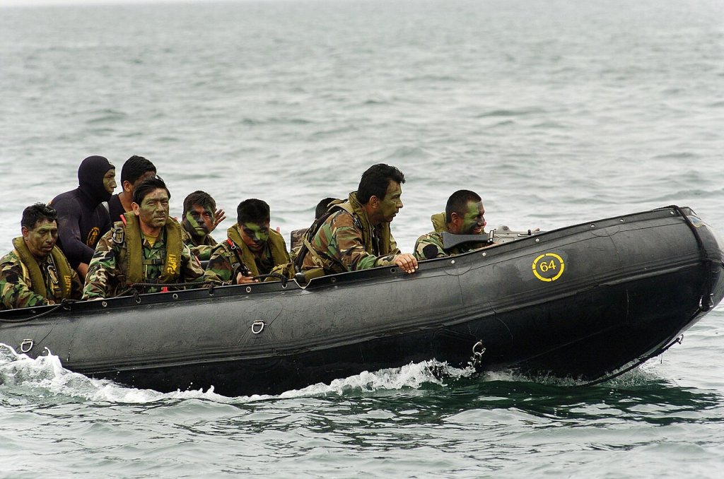 Peruvian Commandos approach the beach in a zodiac boat during the largest amphibious assault exer...