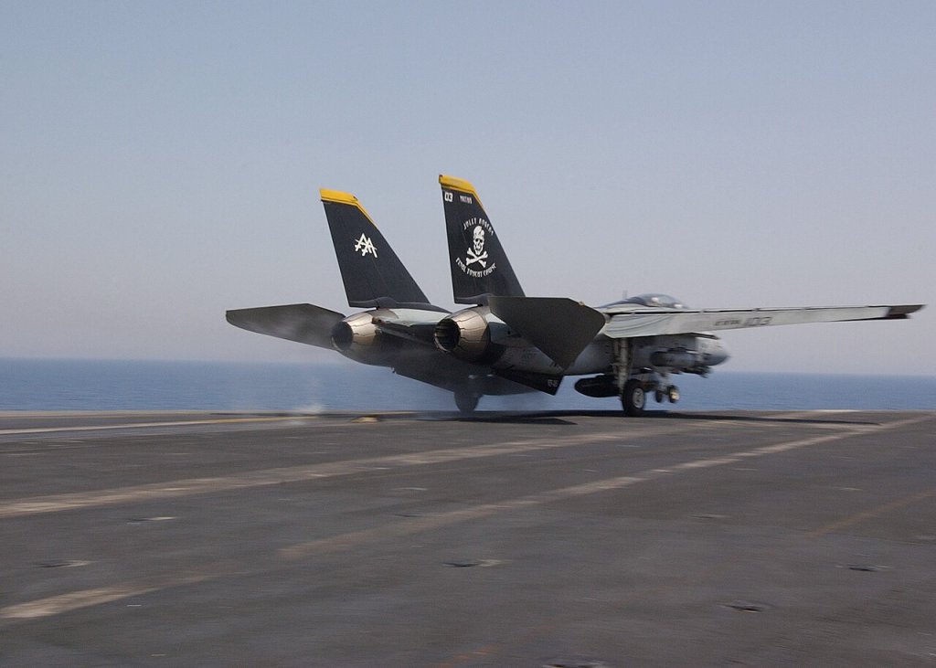 An F-14D Tomcat assigned to the "Jolly Rogers" of Fighter Squadron 103 (VF-103) departs for a fli...