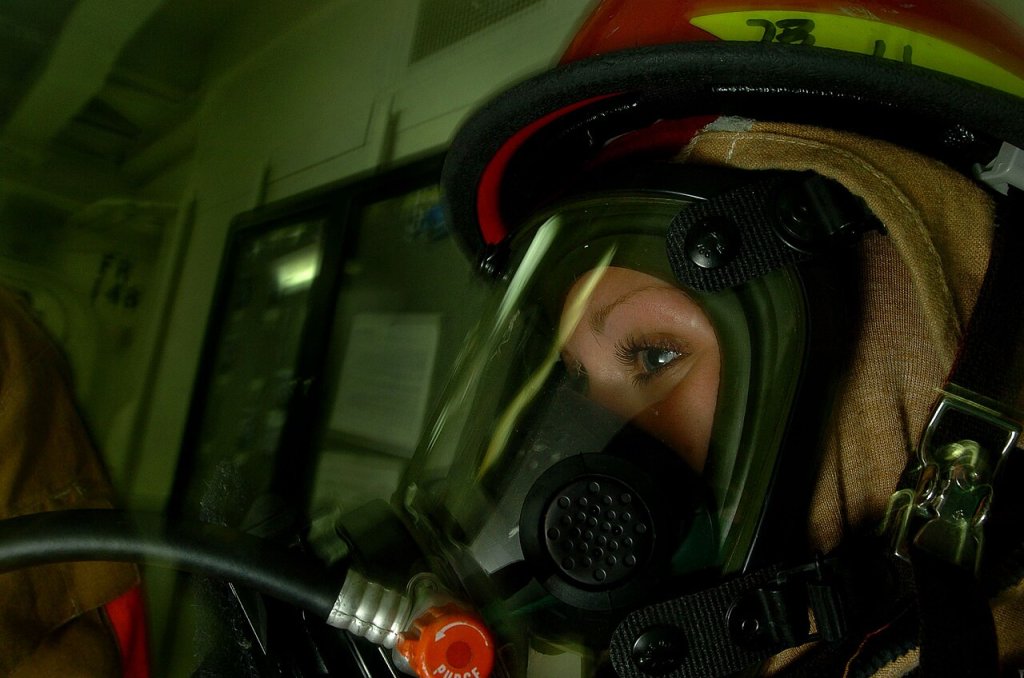 Photographer's Mate Airman Randi Brown from Indianapolis, Ind., mans a fire hose during a General...