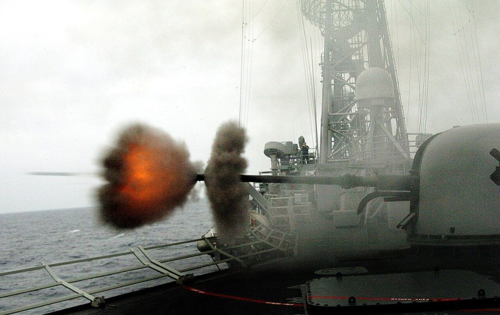 A round is fired from the ship's MK-75 76mm gun aboard the guided missile frigate USS Crommelin