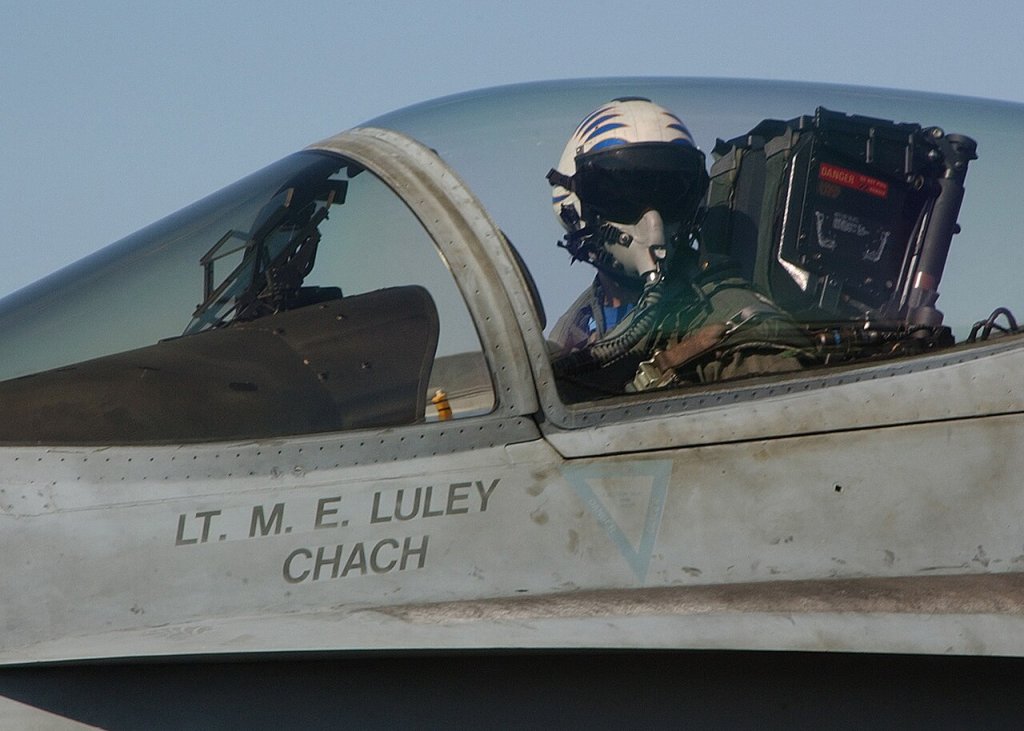 A pilot of an F/A-18C Hornet assigned to the "Rampagers" of Strike Fighter Squadron Eight Thr...