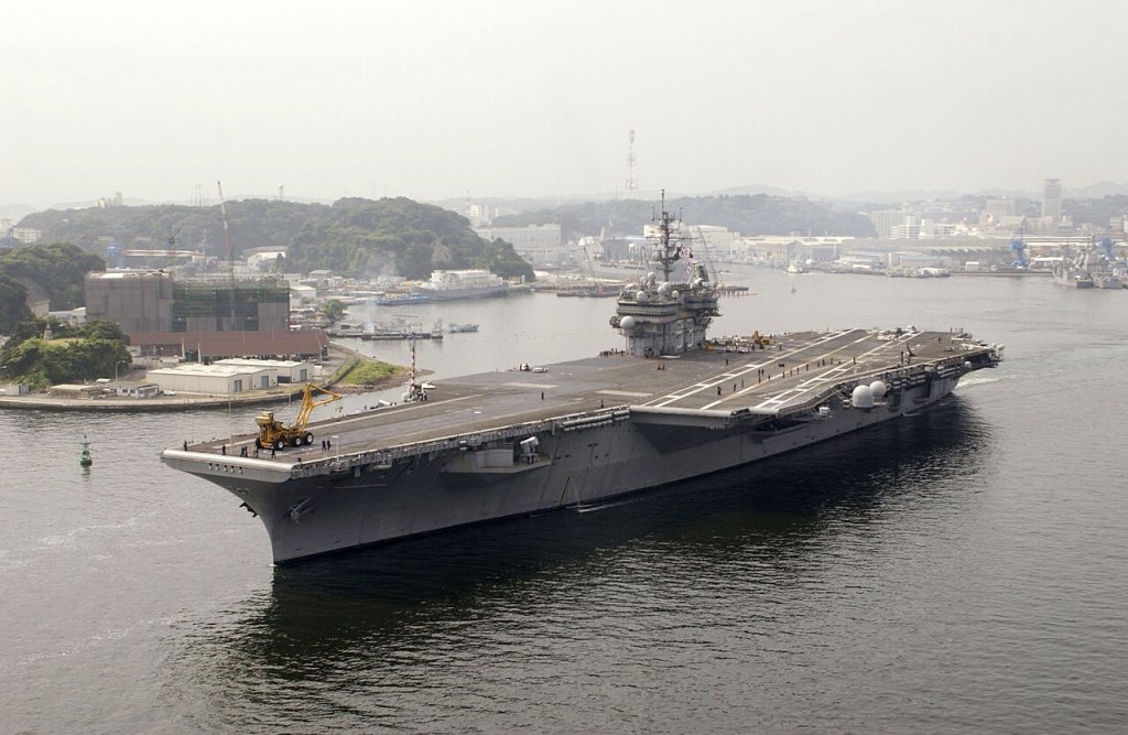 USS Kitty Hawk (CV 63) departs Yokosuka Naval Base and prepares to transit the Tokyo Bay, to the ...