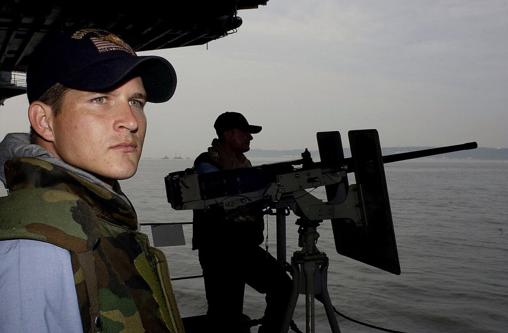 Japan (July 19, 2004) - Crewmembers stand a force protection watch at one of the .50-caliber ma...