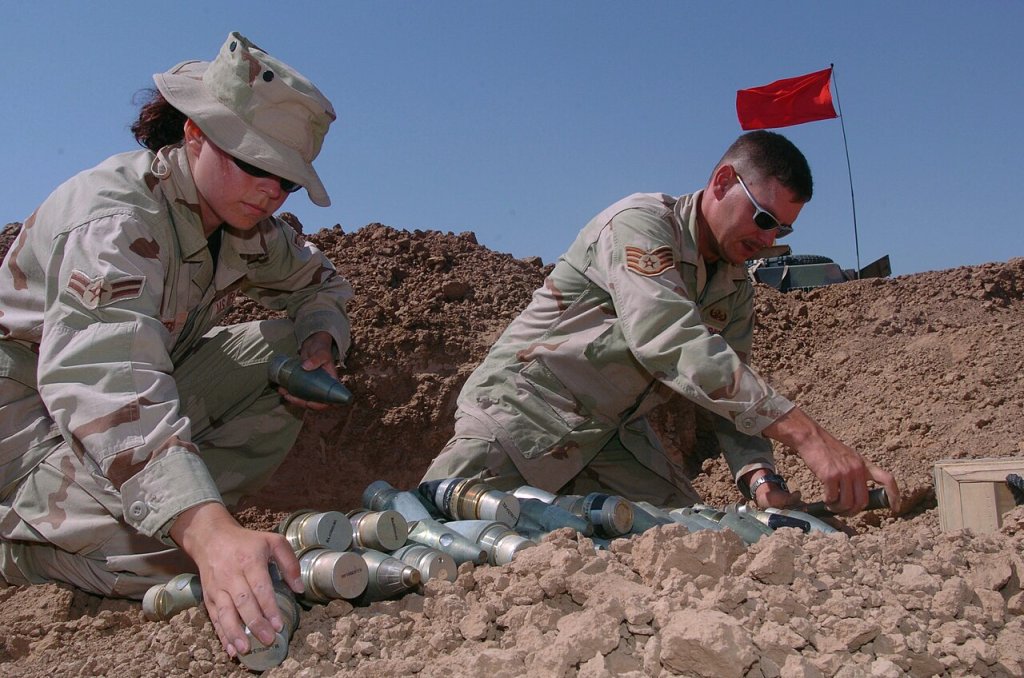 Airmen prepare ammunition fuses, flares and 50 caliber rounds for disposal
