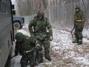 Wisconsin Air National Guard Security Forces Squadron personnel check a bus entering the Volk Fie...