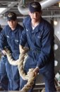 Deck Department crew members single up a mooring line as USS Ronald Reagan (CVN 76) prepares to l...