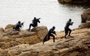 Navy SEALs practice Over The Beach evolutions during a training exercise