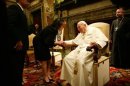 Mrs Laura Bush takes the hand of Pope John Paul II
