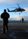 Pacific Ocean (June 19, 2004) - Members of Explosive Ordnance Disposal (EOD) Mobile Unit 11 emb...