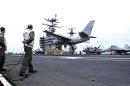 Pacific Ocean (June 19, 2004) - A Landing Signal Officer (LSO) monitors the arrested landing of...