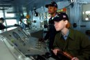 Pacific Ocean (June 24, 2004) - Seaman Kristin McKee, of Las Vegas, Nev., keeps the ship on a s...