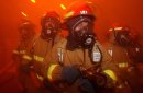Sailors from repair locker "One Alpha" simulate fighting fires in the hangar bay, during a Ge...