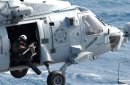 Aviation Warfare Systems Operator 2nd Class Bryan Branco stands a force protection watch from an ...
