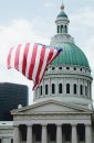 Old Courthouse dome with large flag flying in foreground