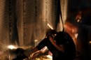 Washington, D.C., (July 9, 2004) - A young women sits in front of the Vietnam Veterans Memorial...