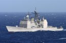 The guided missile cruiser USS Gettysburg (CG 64) makes her approach along side USS Detroit