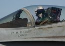 A pilot of an F/A-18C Hornet assigned to the "Rampagers" of Strike Fighter Squadron Eight Thr...