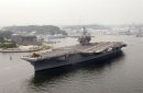 USS Kitty Hawk (CV 63) departs Yokosuka Naval Base and prepares to transit the Tokyo Bay, to the ...