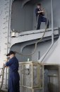 Seaman Maria Garcia, from Lakeland, Minn., and Seaman Adam Rich, from Asheboro, N.C., stow a moor...